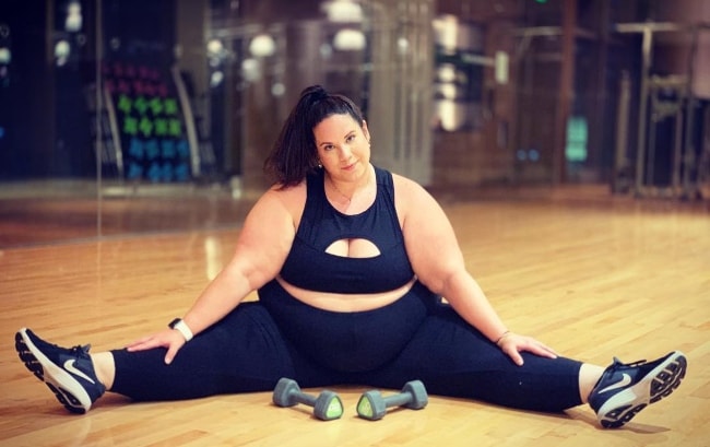 Whitney Way Thore posing at the gym