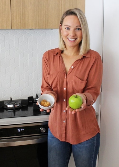 Steph Wearne posing with a granny smith apple and miso paste