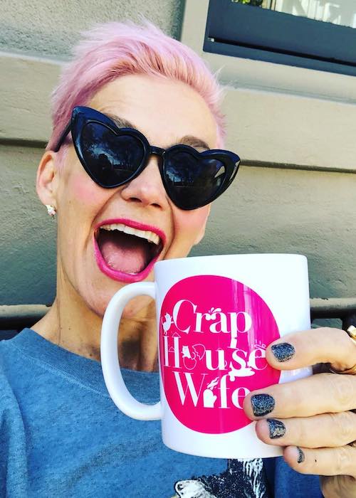 Jessica Rowe holding Crap Housewife mug in September 2018