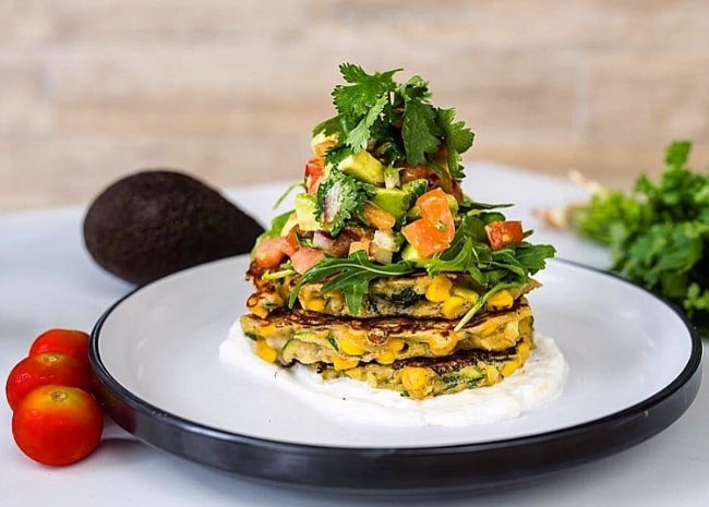 Corn and zucchini fritters with avocado salsa